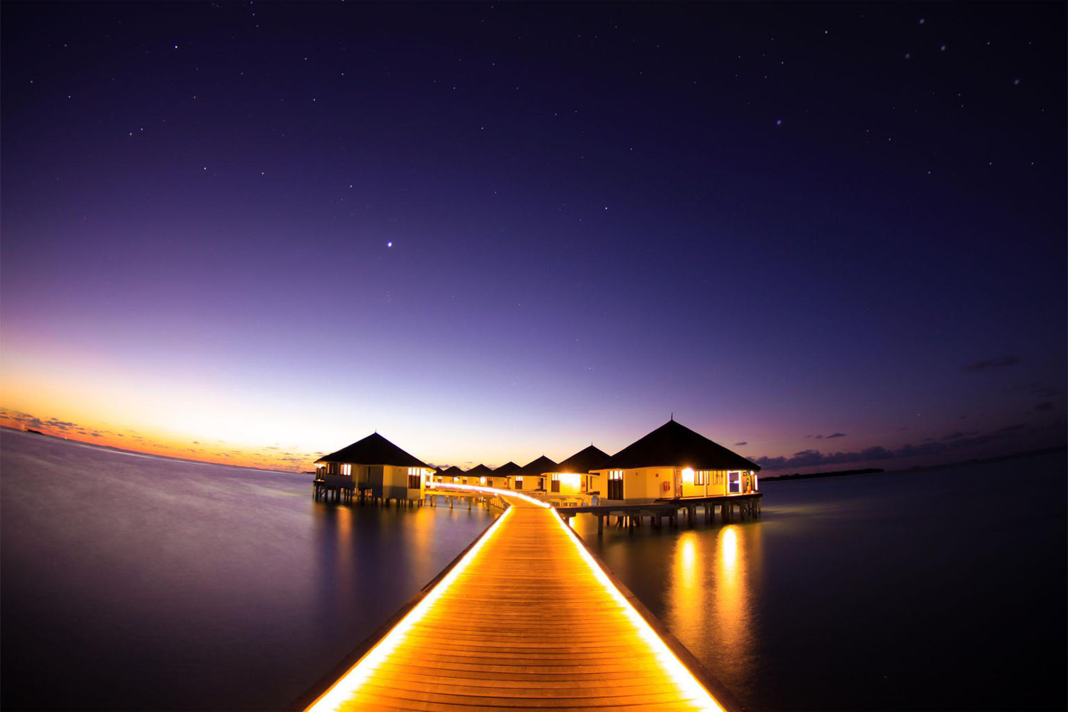 Luxury Maldives overwater villa with turquoise lagoon – perfect for honeymoon tour packages from Mumbai