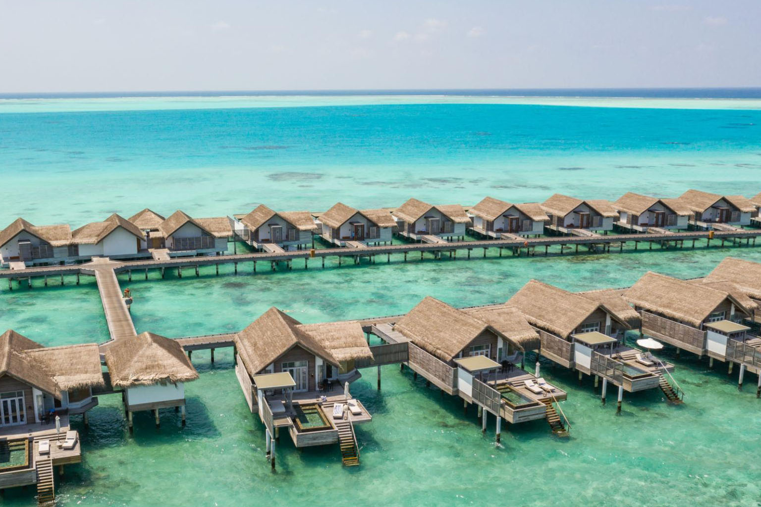 Overwater villas in Maldives tour package from Delhi – crystal clear lagoon view